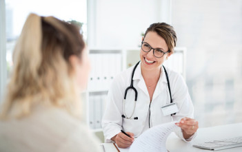 Cropped shot of an attractive young female doctor consulting with a patient inside her office at a hospital