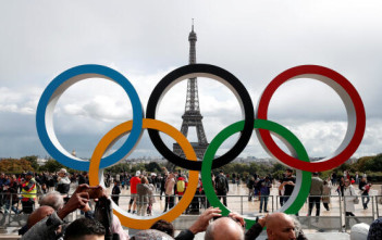 FILE PHOTO: Olympic rings to celebrate the IOC official announcement that Paris won the 2024 Olympic bid are seen in front of the Eiffel Tower at the Trocadero square in Paris, France, September 16, 2017. REUTERS/Benoit Tessier/File Photo